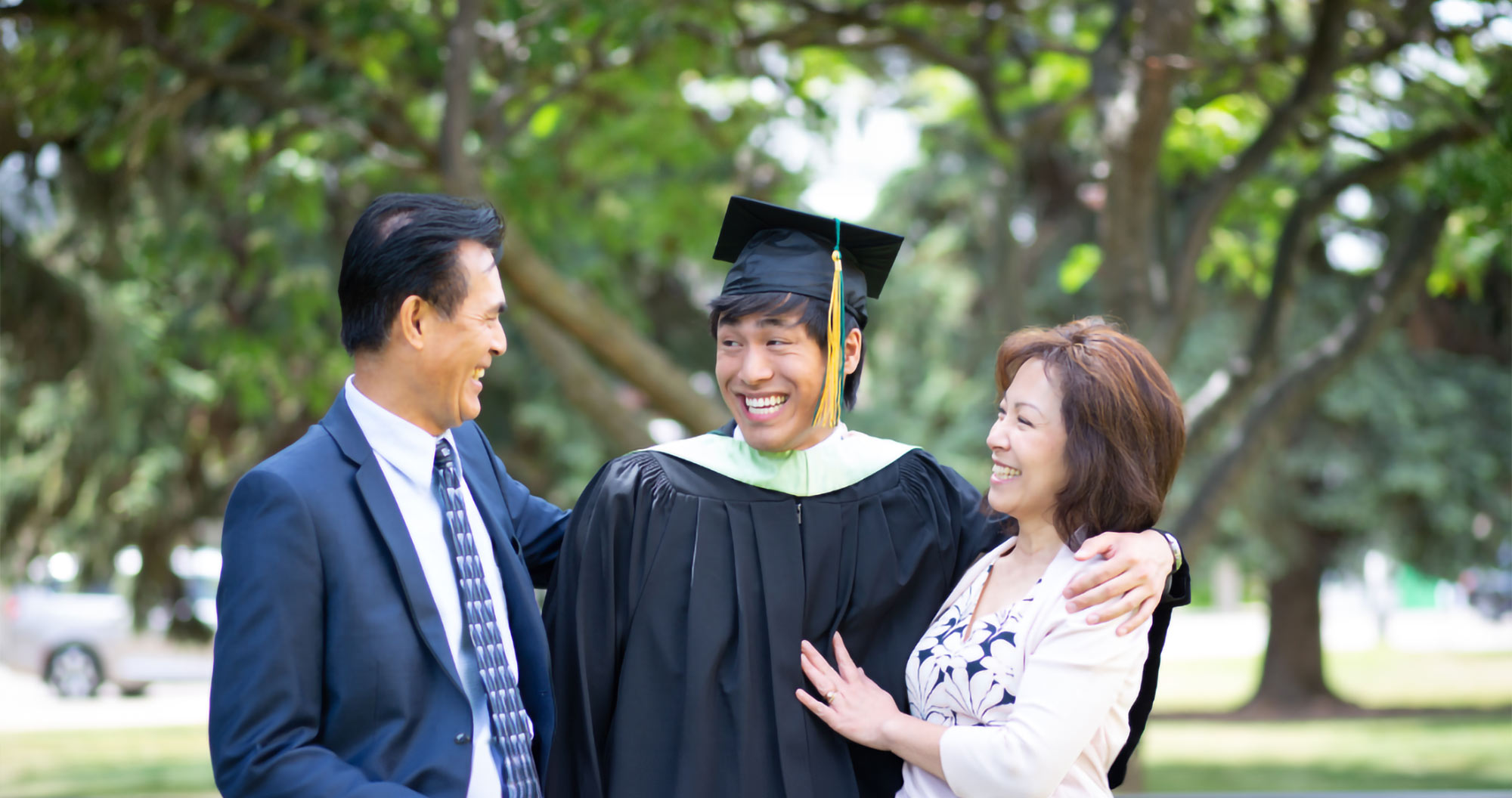 Parents celebrating with their graduating son