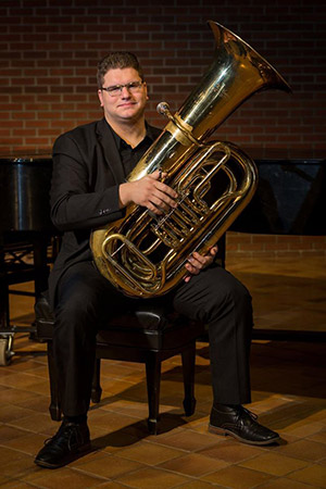 David Salmon posing with his tuba