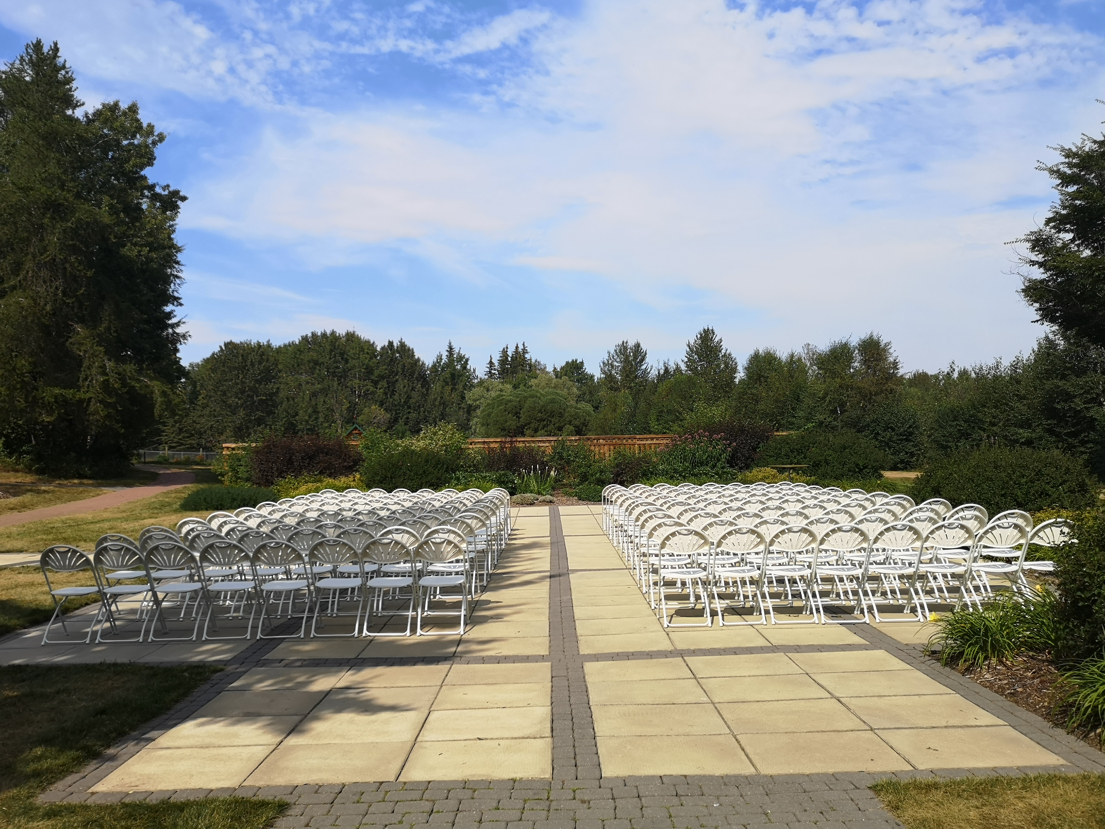 Wedding Patio from behind with white chairs setup