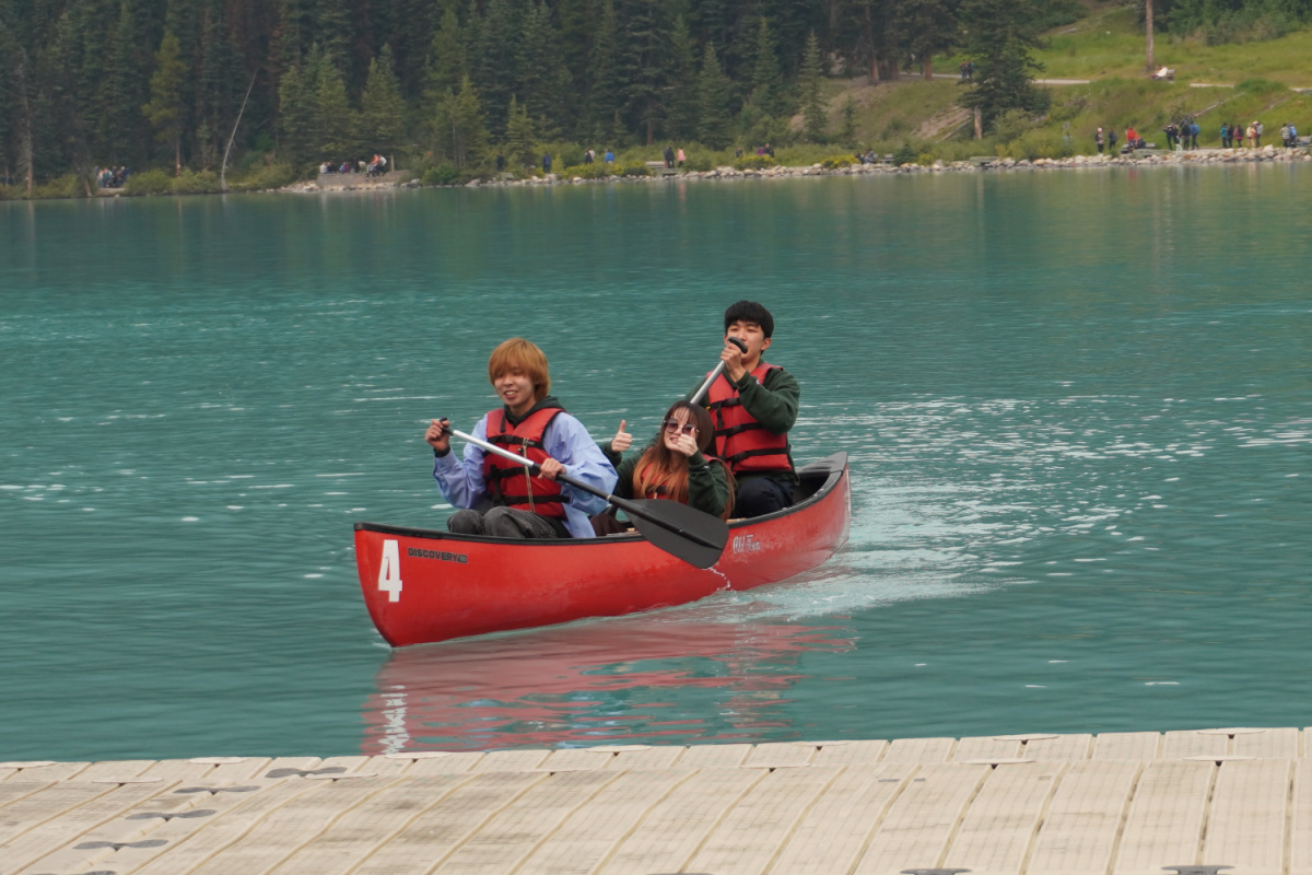 3 students in a canoe