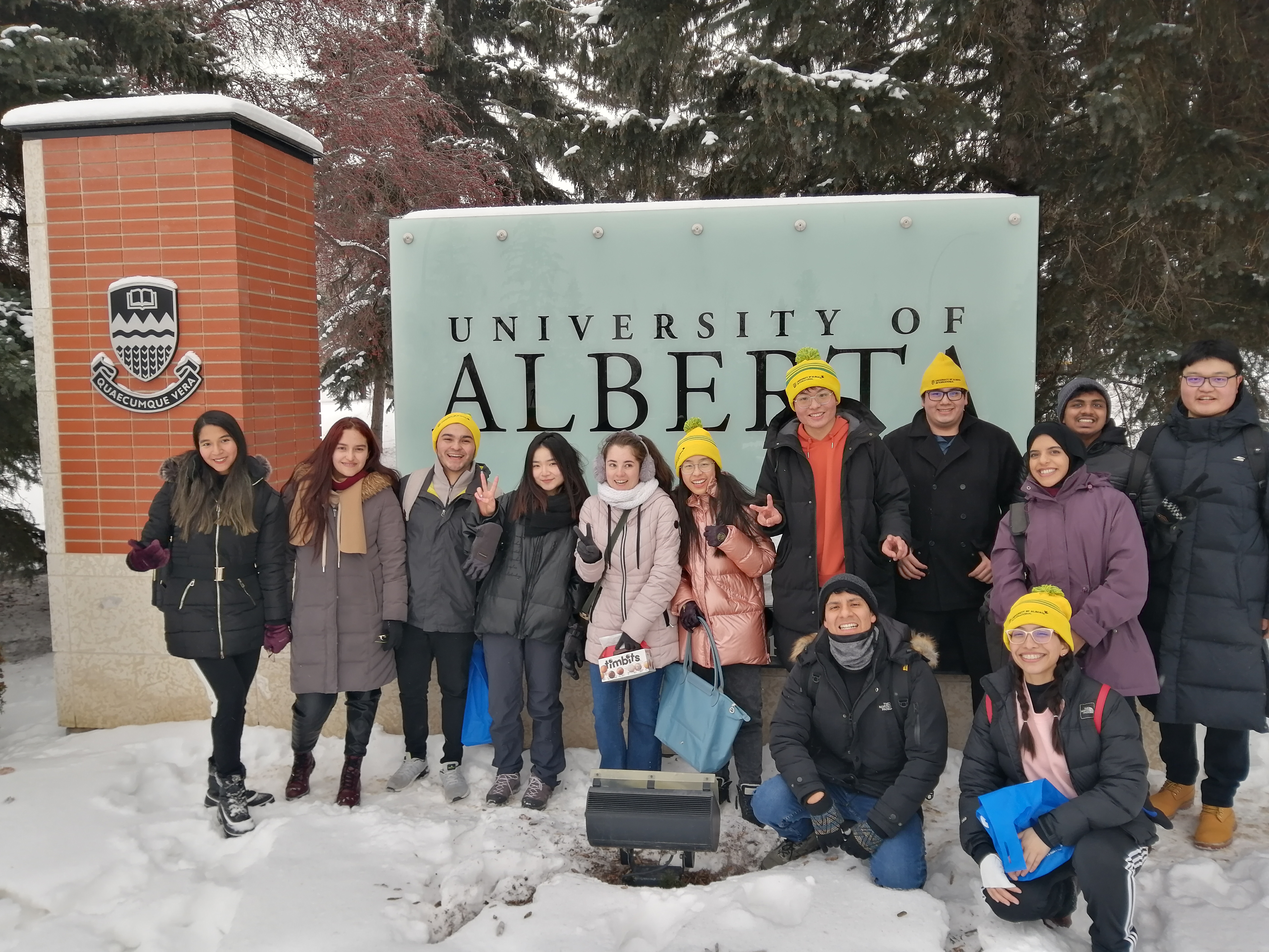 Research Interns posing beside University of Alberta campus sign