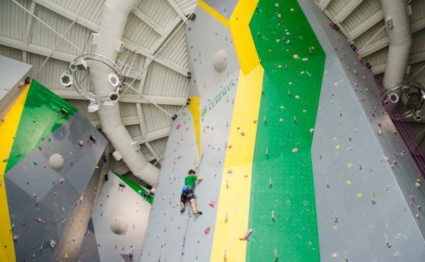 A climber on North Campus' climbing wall at the Wilson Climbing Centre.