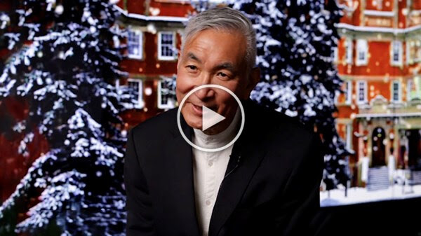 Video thumbnail showing Dean Yada in front of a holiday backdrop with a play button