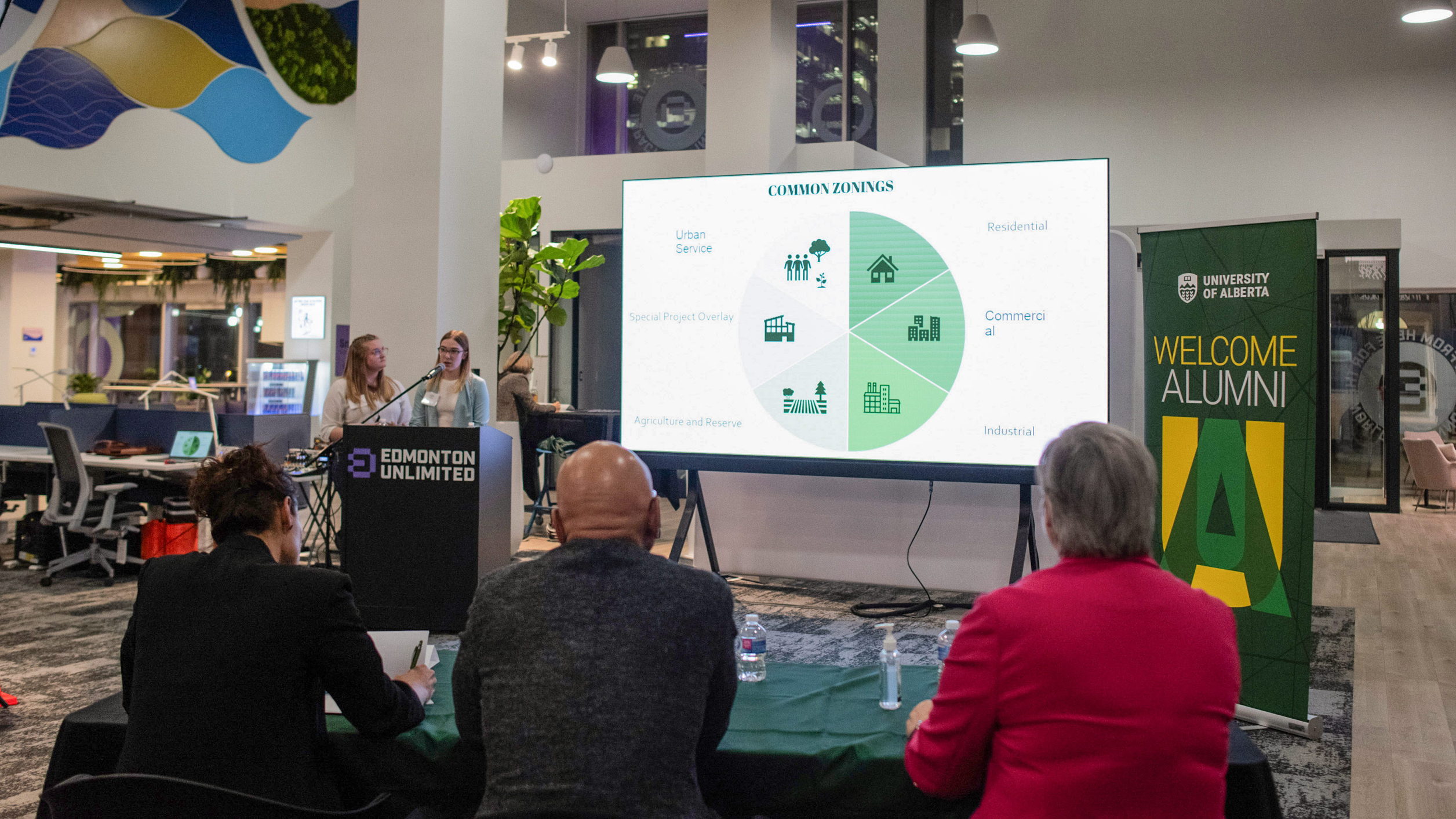 Students give a powerpoint presentation to a panel of judges in the professional-looking Edmonton Unlimited office