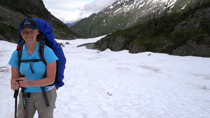 snowy mountain landscape with Christina hiking