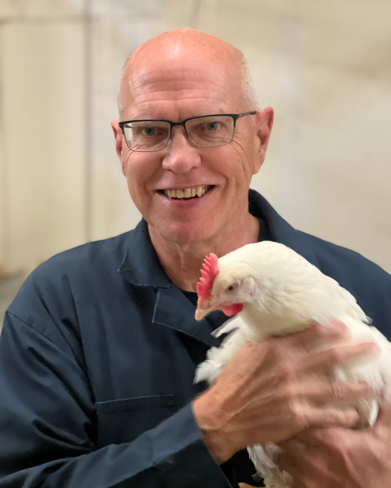 Frank holds a chicken