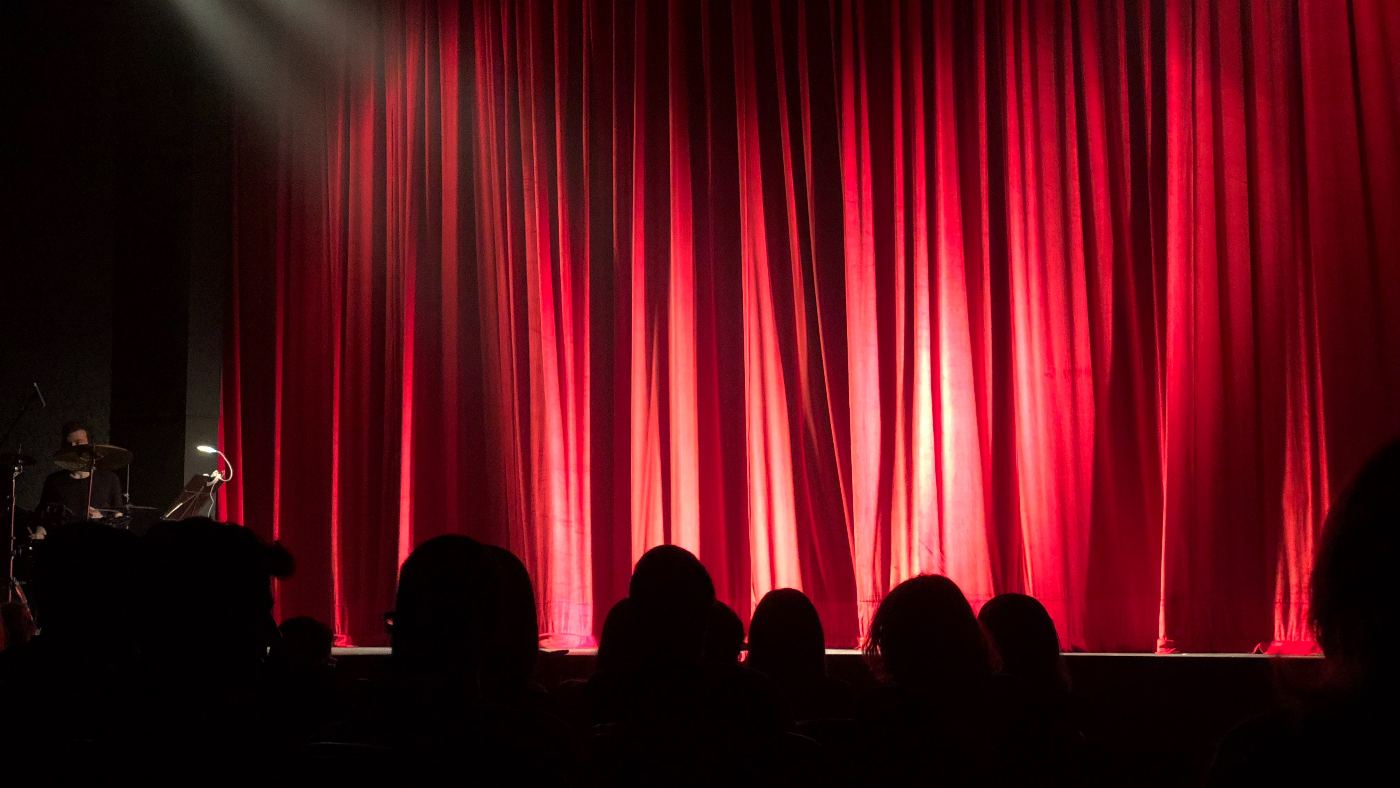 Curtains closed before a theatre show