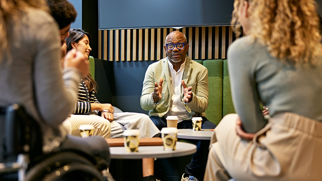 Getty images: multiracial project manager discussing ideas with team