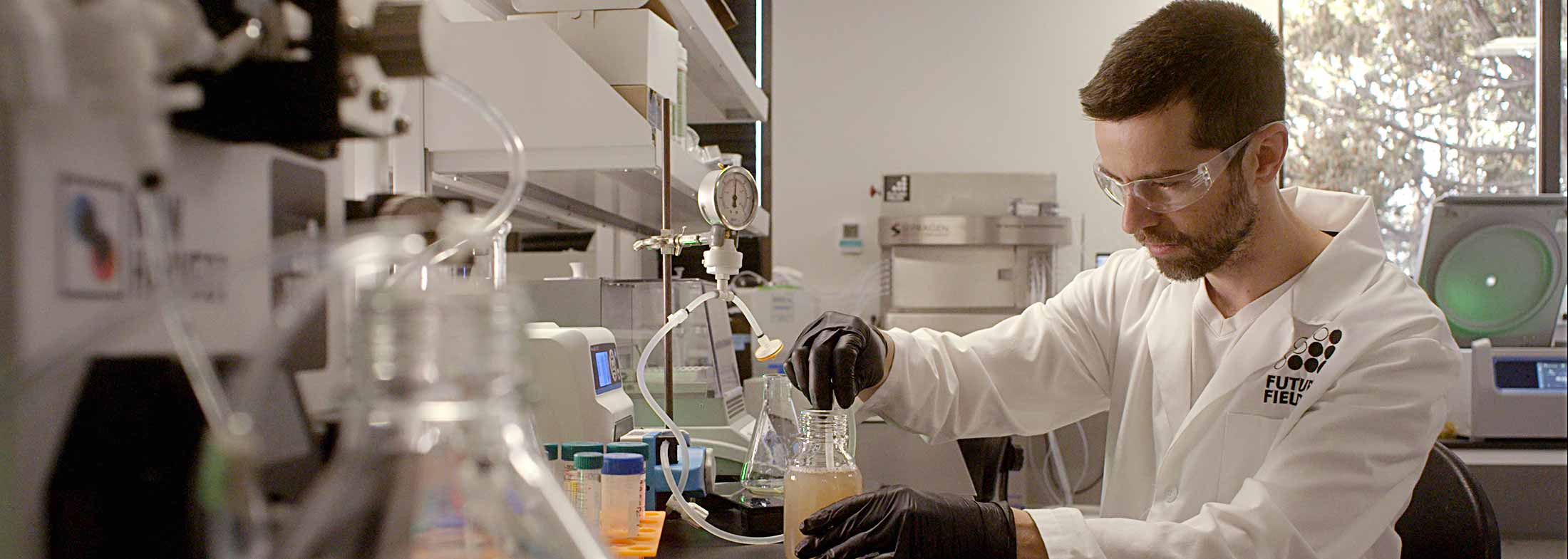 Scientist working with beakers