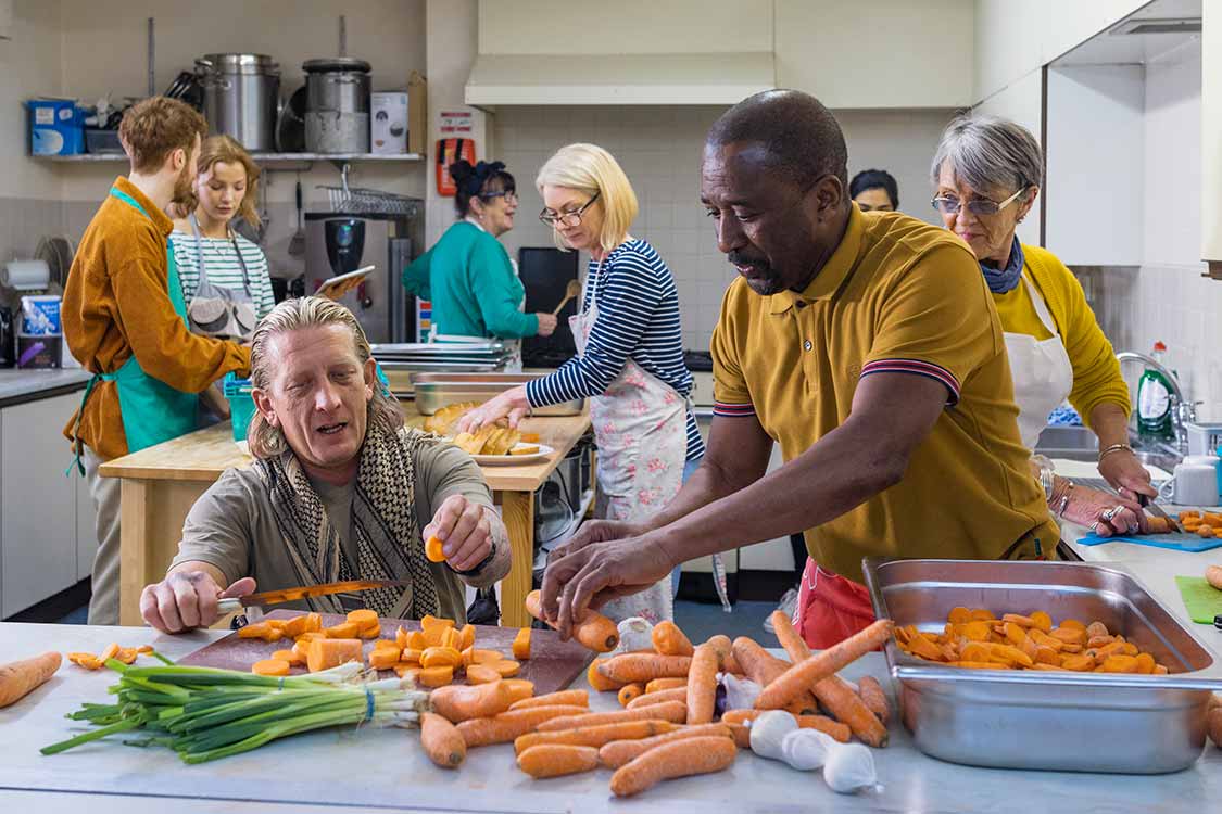 Volunteers work in a kitchen