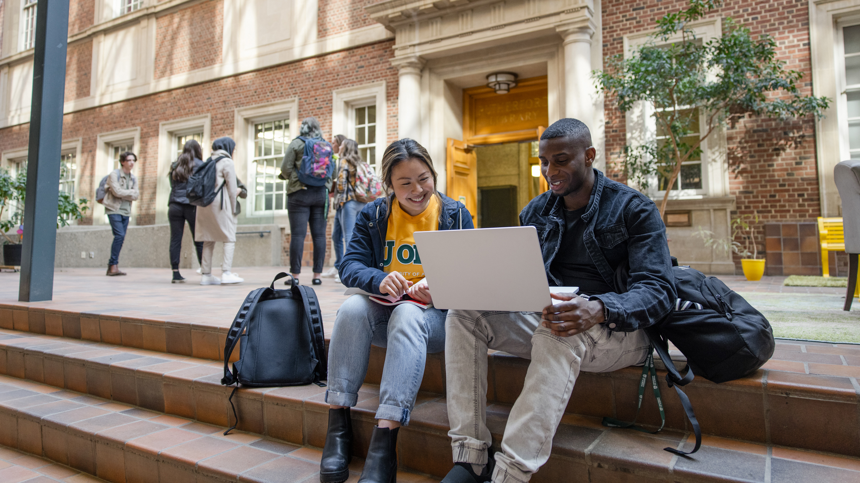 Two students in front of Rutherford library