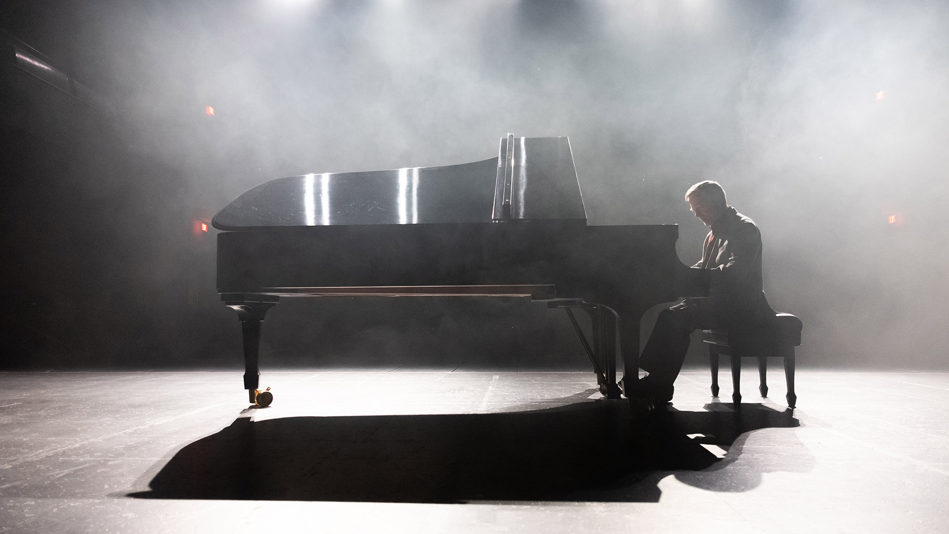 Roger Admiral playing a grand piano