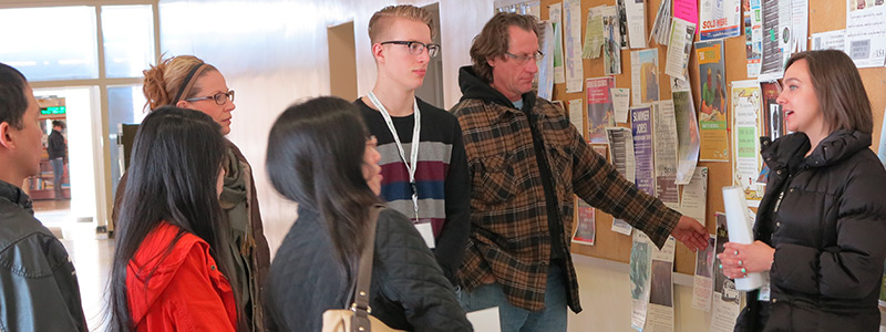 A photo of a group of students and parents on a campus tour during a Preview Day event.