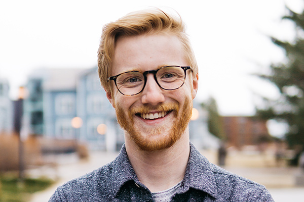 A photo of Braeden Kelly in front of Founders' Hall.