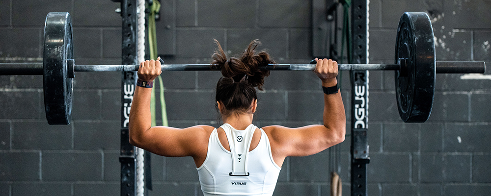 An image of a woman weightlifting.