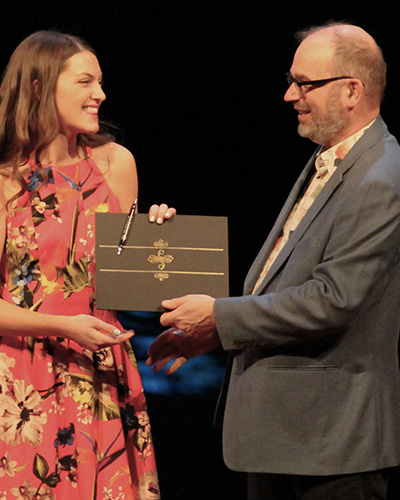 Onesimus Award recipient, Kyra Gusdal, and Augustana Chaplain, Craig Wentland.