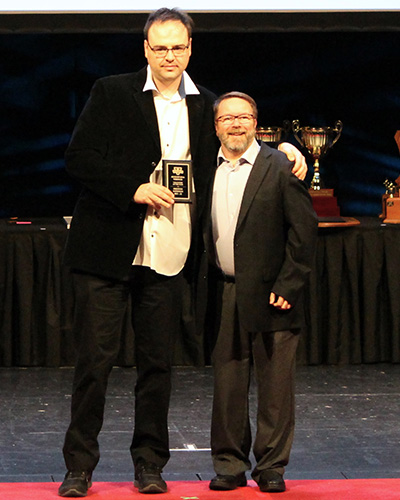 Vikings Volunteer of the Year recipient, Preston Wideman (left), and Vikings men's basketball coach, Dave Drabiuk.