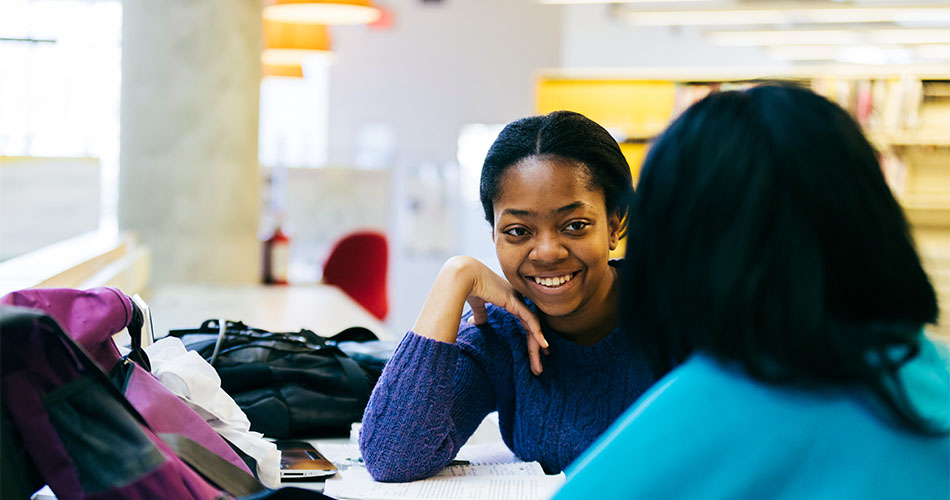 A photo of a two students having a discussion