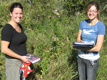 2 students posing in the field