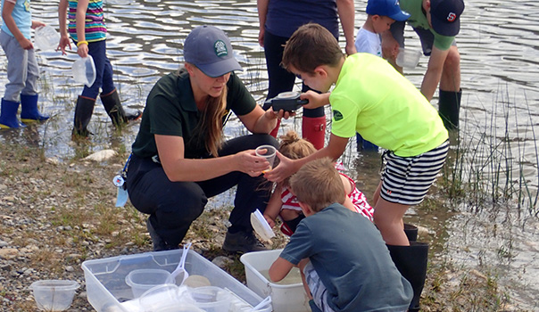 A park interpreter working with children in a wetlands park.