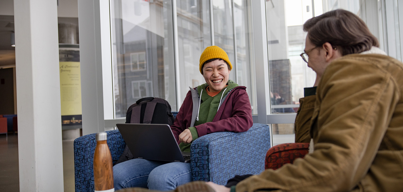 Students sitting in the Forum.