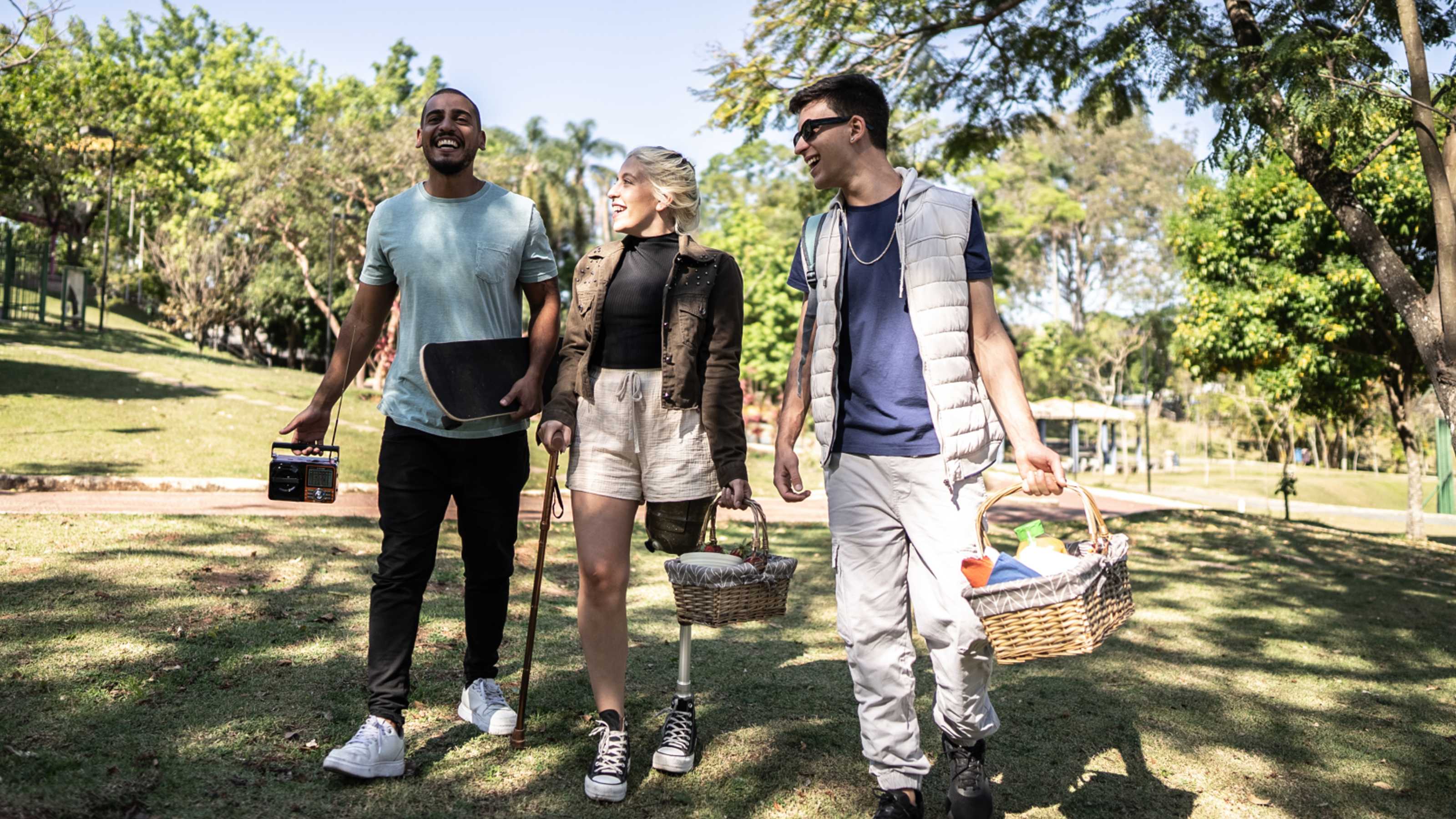 Three people with picnic baskets