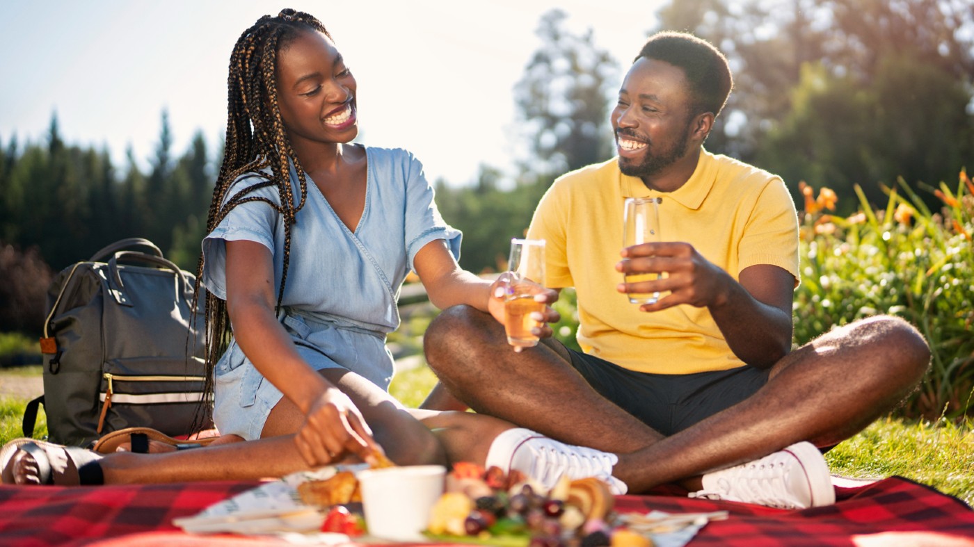 Two people having a picnic outside