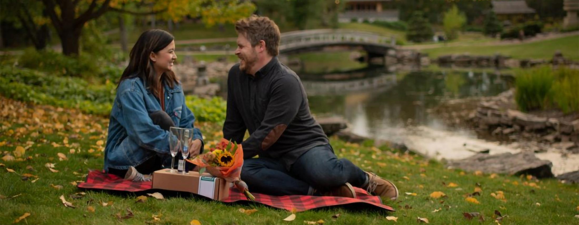 Couple at the U of A Botanic Garden enjoying a picnic at twilight