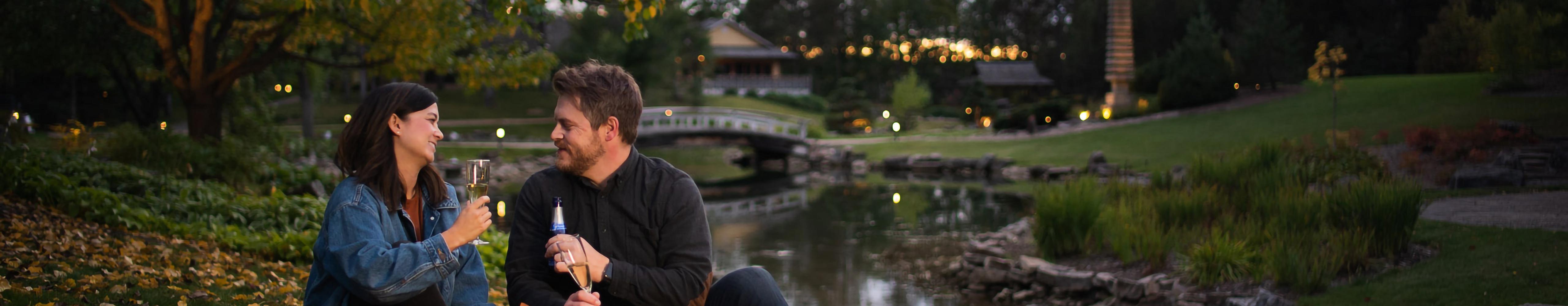 Two people picnicking in the Kurimoto Japanese Garden