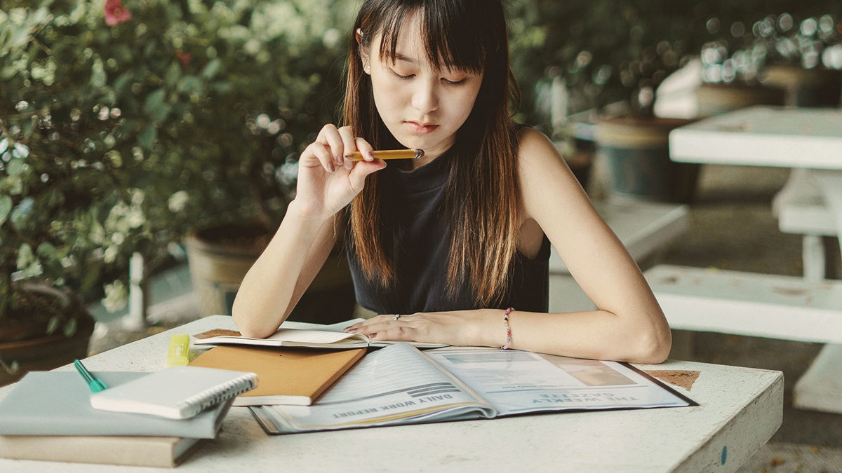 Female taking GMAT exam