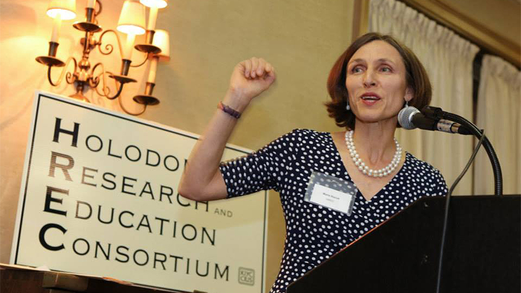 A woman speaking at the Holodomor Research and Education Consortium