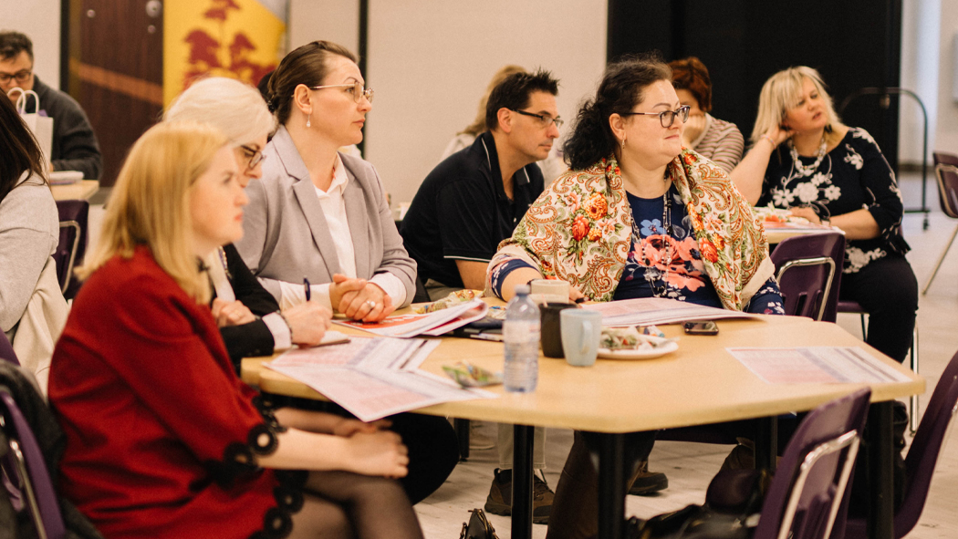 A group of people listening to a speak at the Ukrainian Language Education Centre