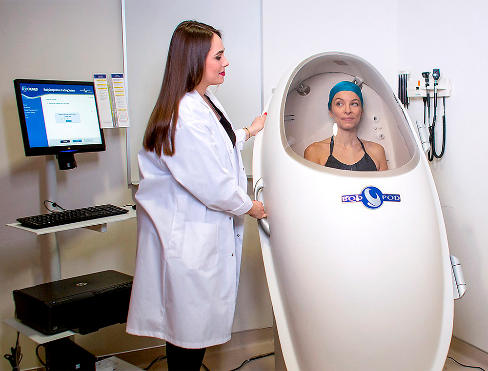 Carla Prado with a patient in the Bod Pod.