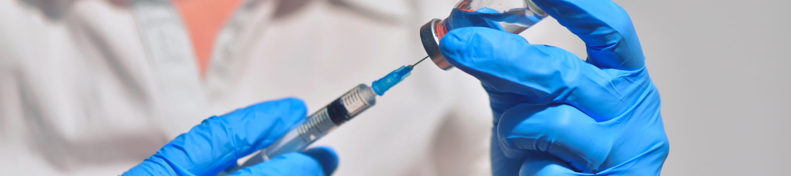 Picture of a person preparing a needle.