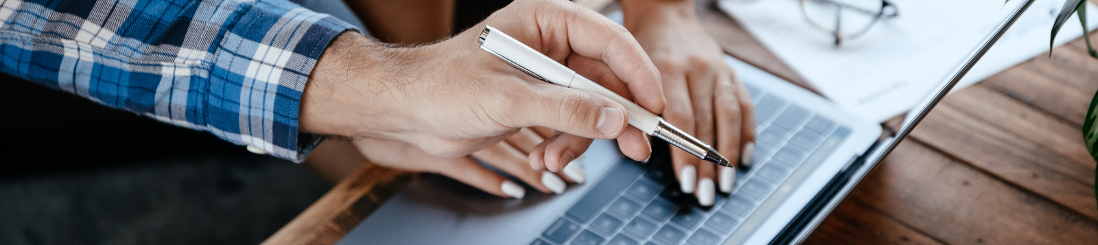 A picture of two people working together on a task.