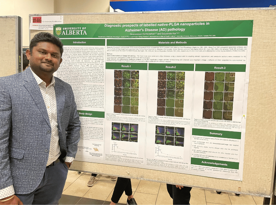 Karthivashan Govindarajan standing beside his poster board