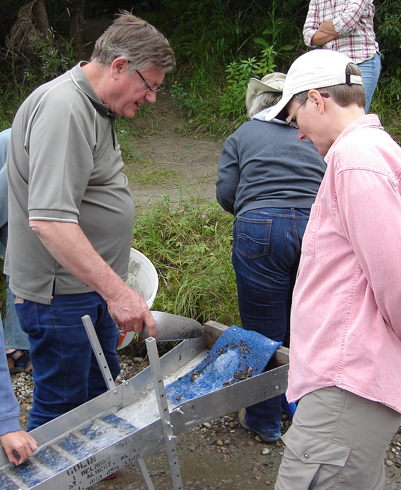 Sluice separating gold from sand and gravel