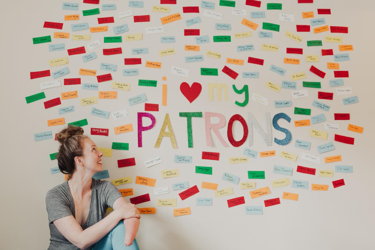 Hillyard poses with her Wall of Patrons