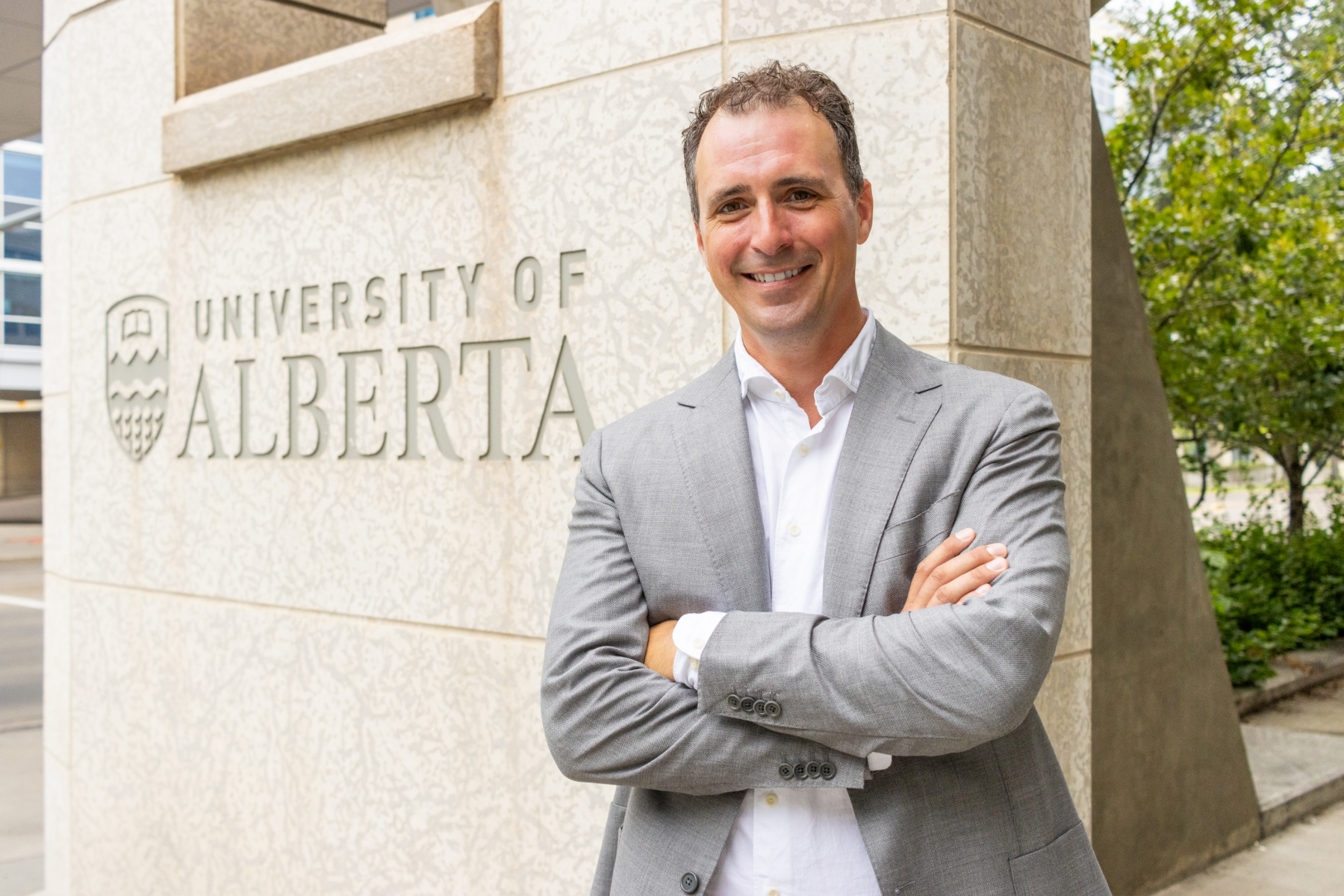 Josh Markle beside U of A sign