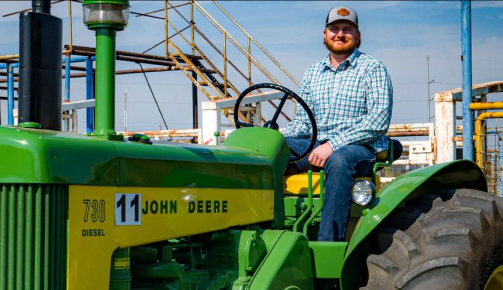 student sitting on a tractor