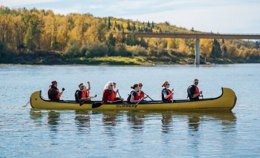 People rowing a canoe