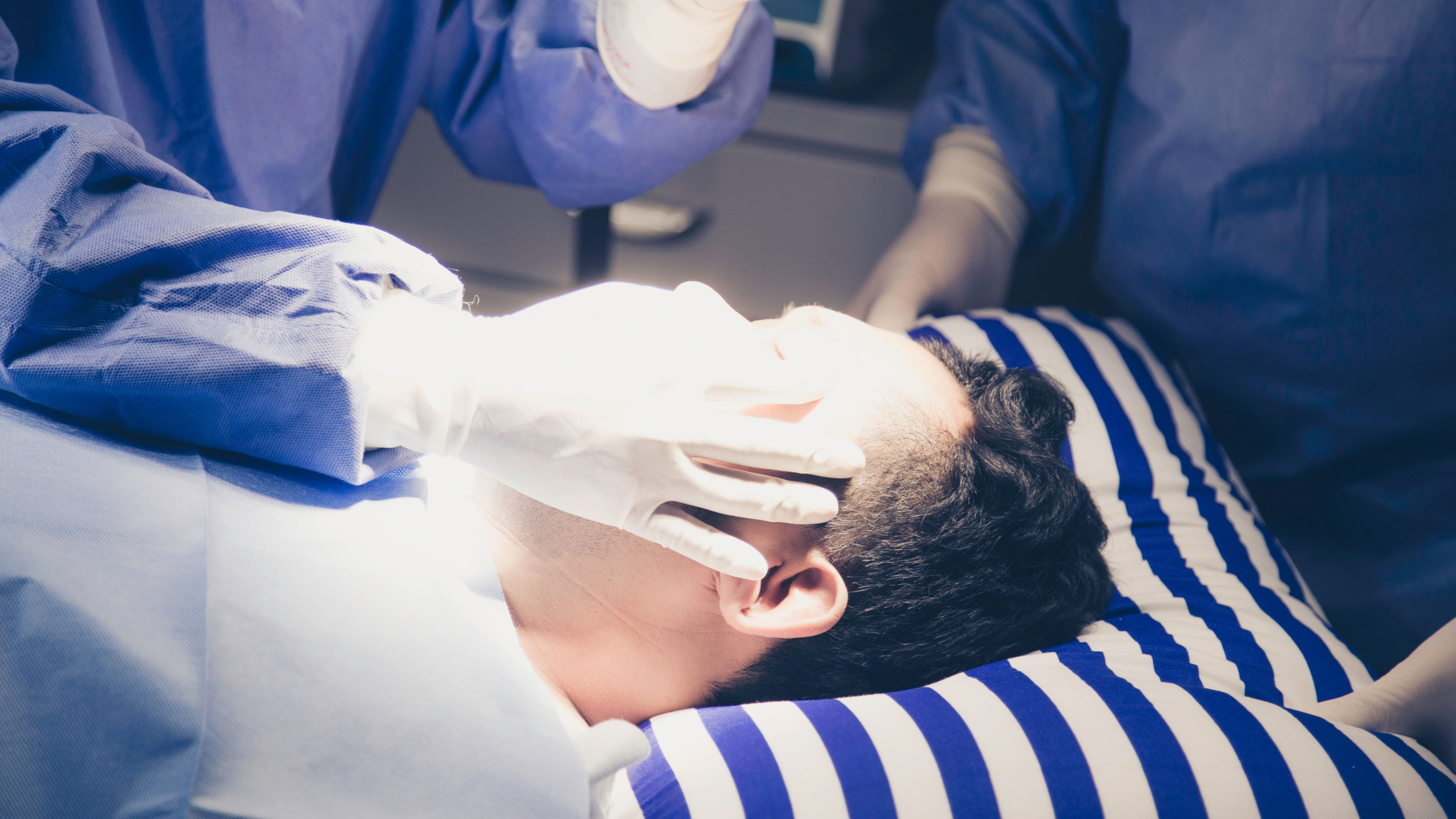 Doctors performing a test on a patient