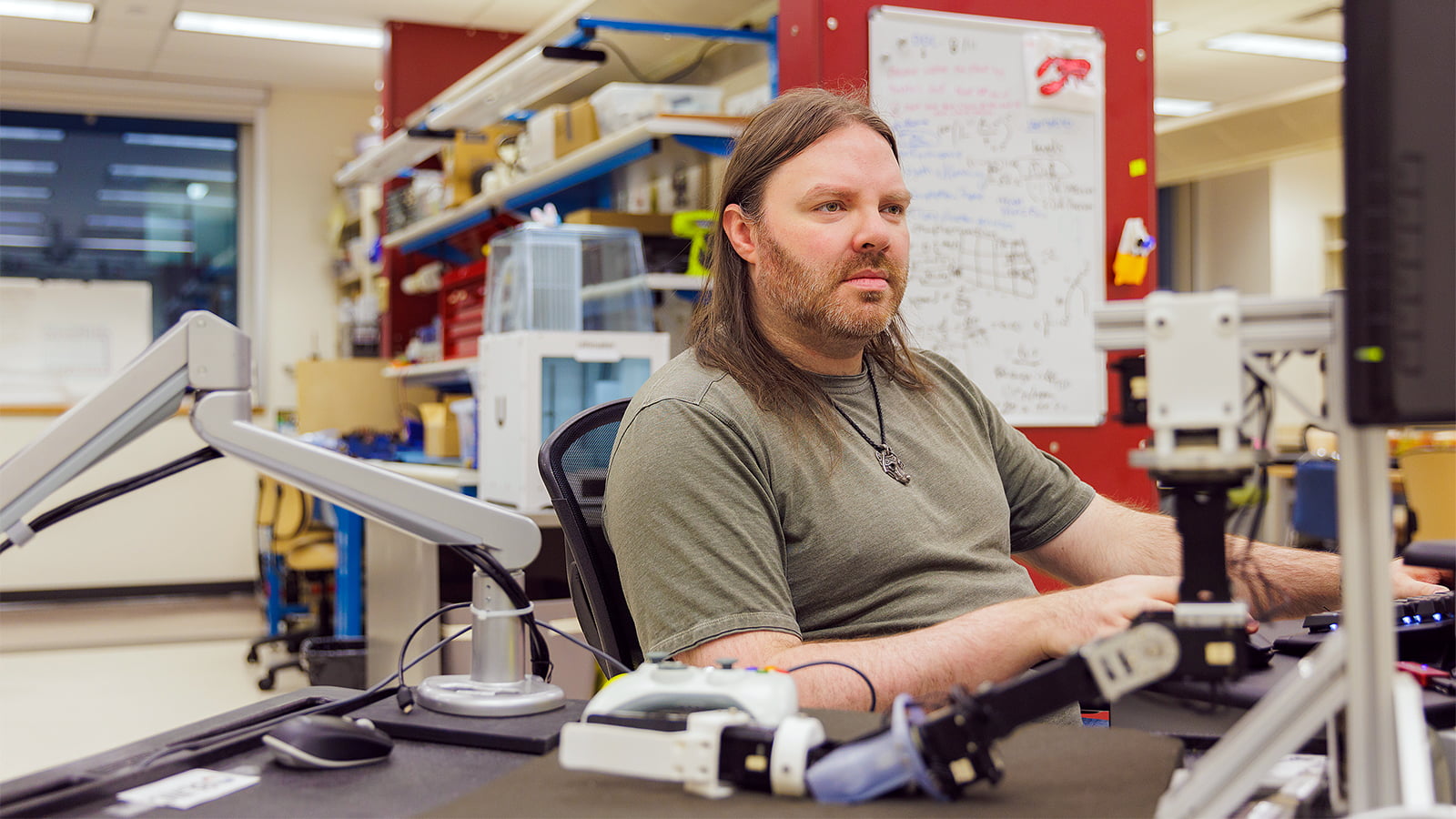 For his doctoral research in rehabilitation science, Adam Parker uses AI to teach a prosthetic limb to give real-time feedback to its user, allowing true collaboration between human and machine. (Photo: Alex Pugliese)