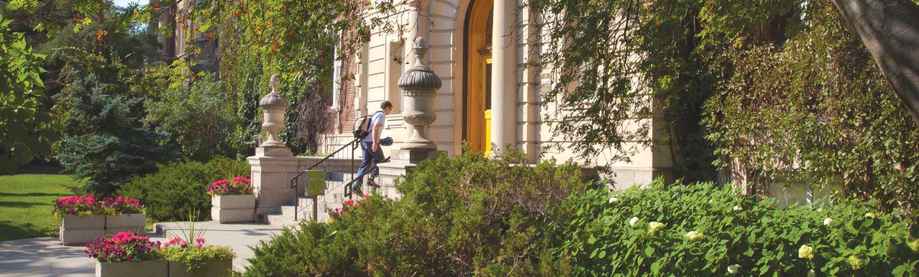 Student entering a building on the U of A North Campus