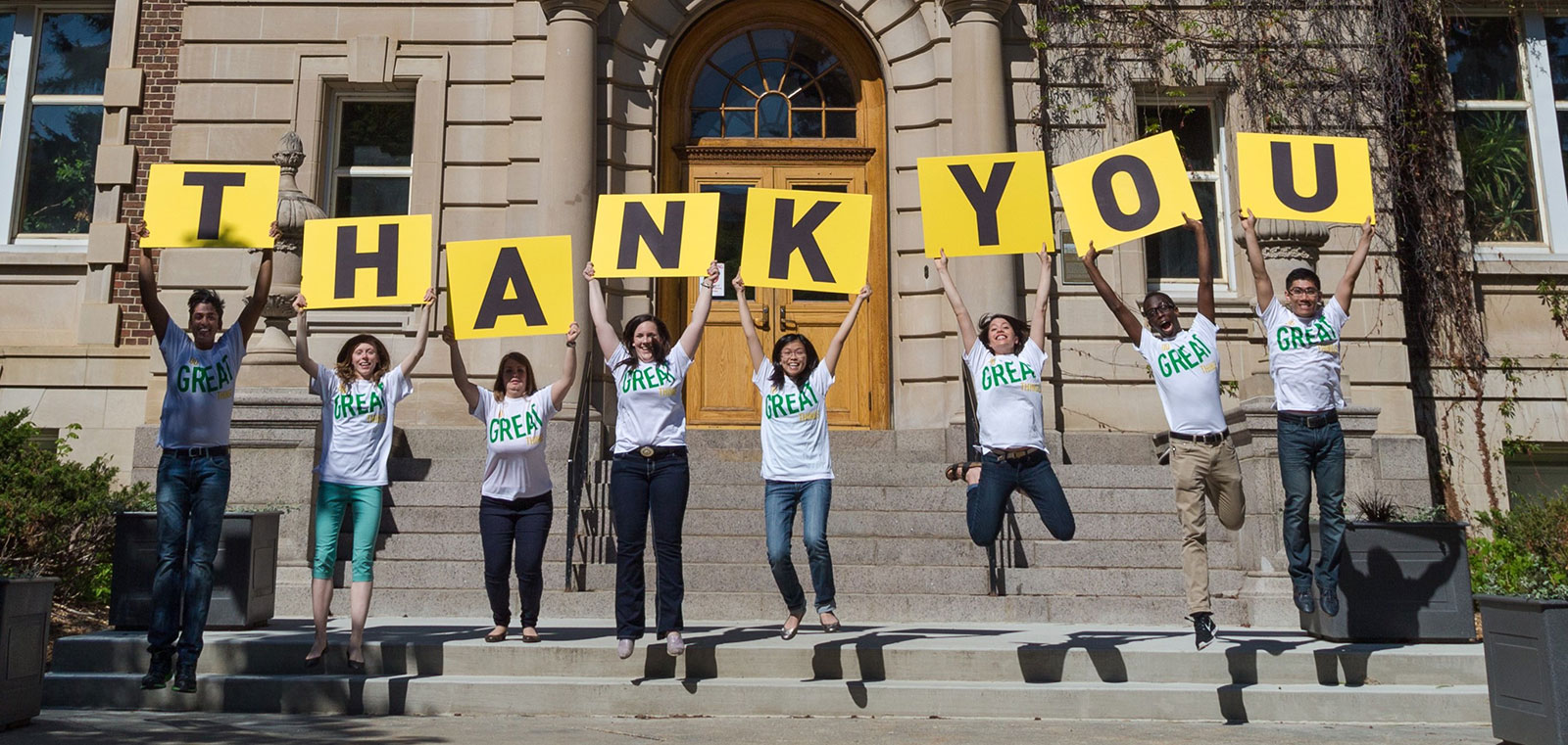 Students holding a thank you sign