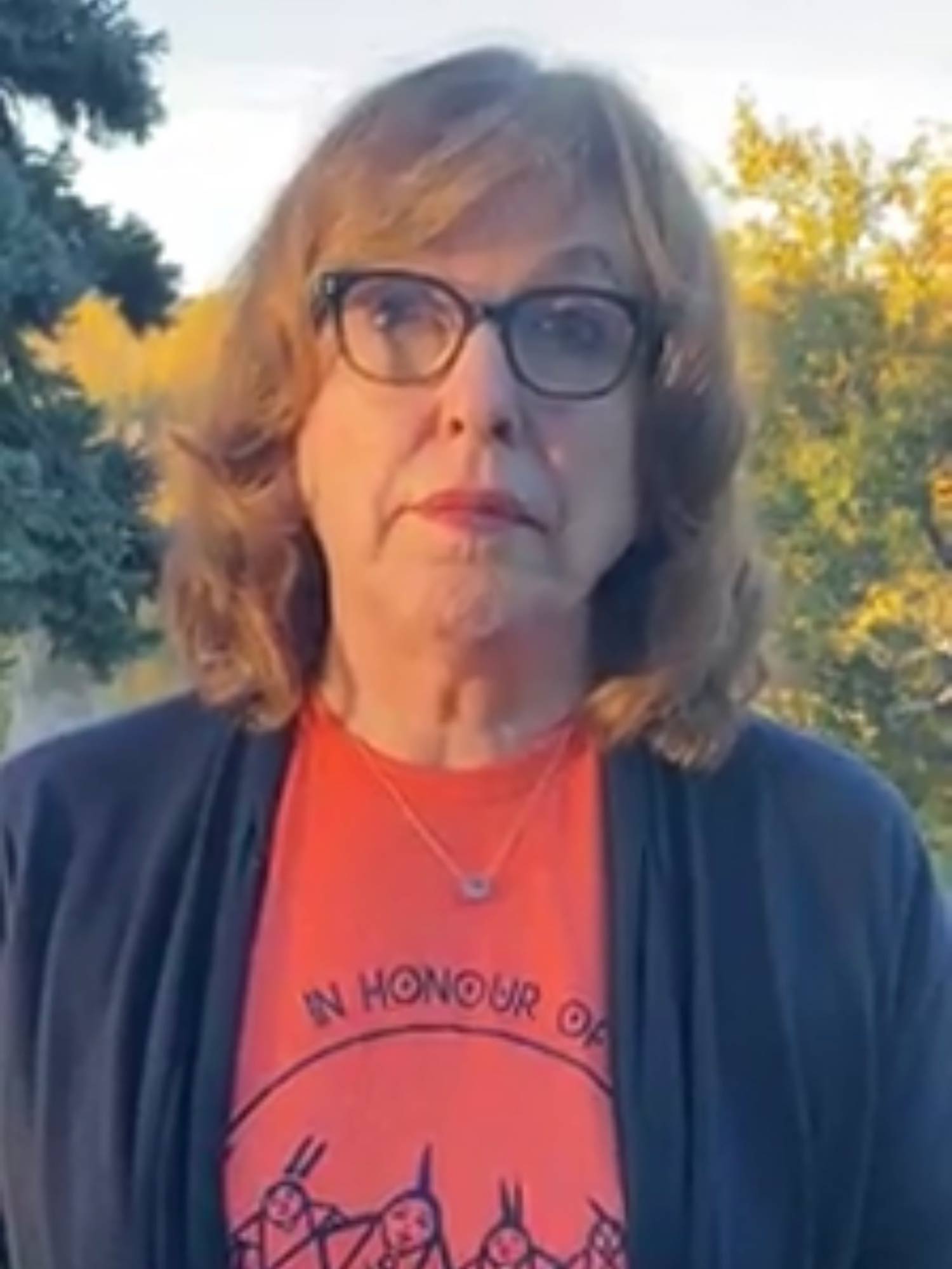 Diane Kunyk wearing an orange shirt