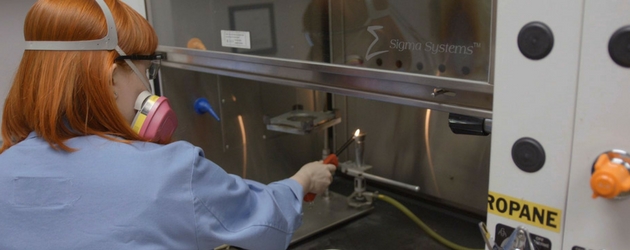 textile researcher works at a lab bench