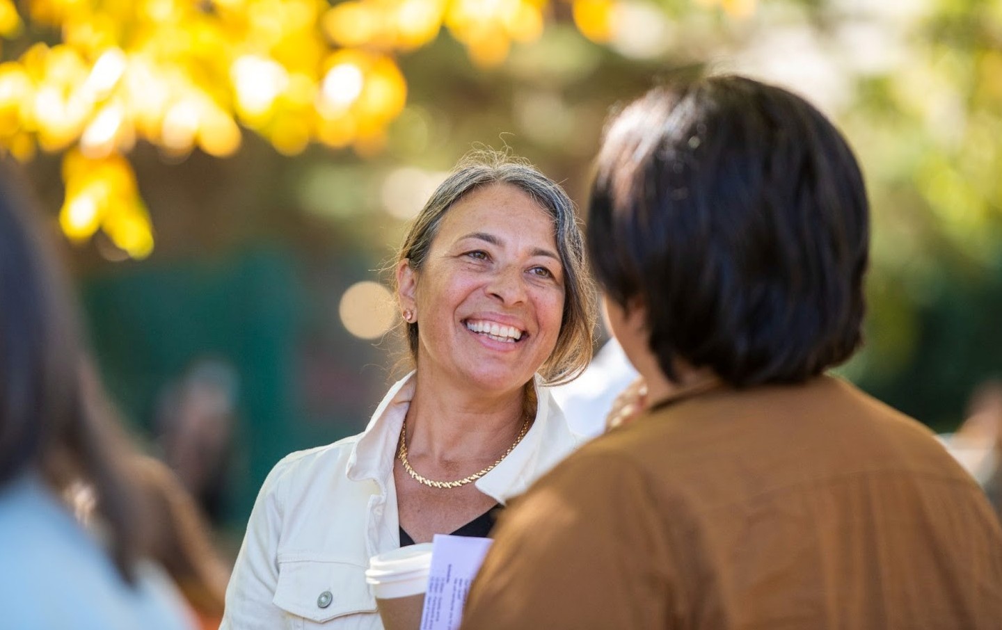 Woman smiling at man