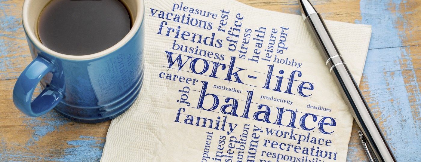 coffee cup with napkin that says work life balance