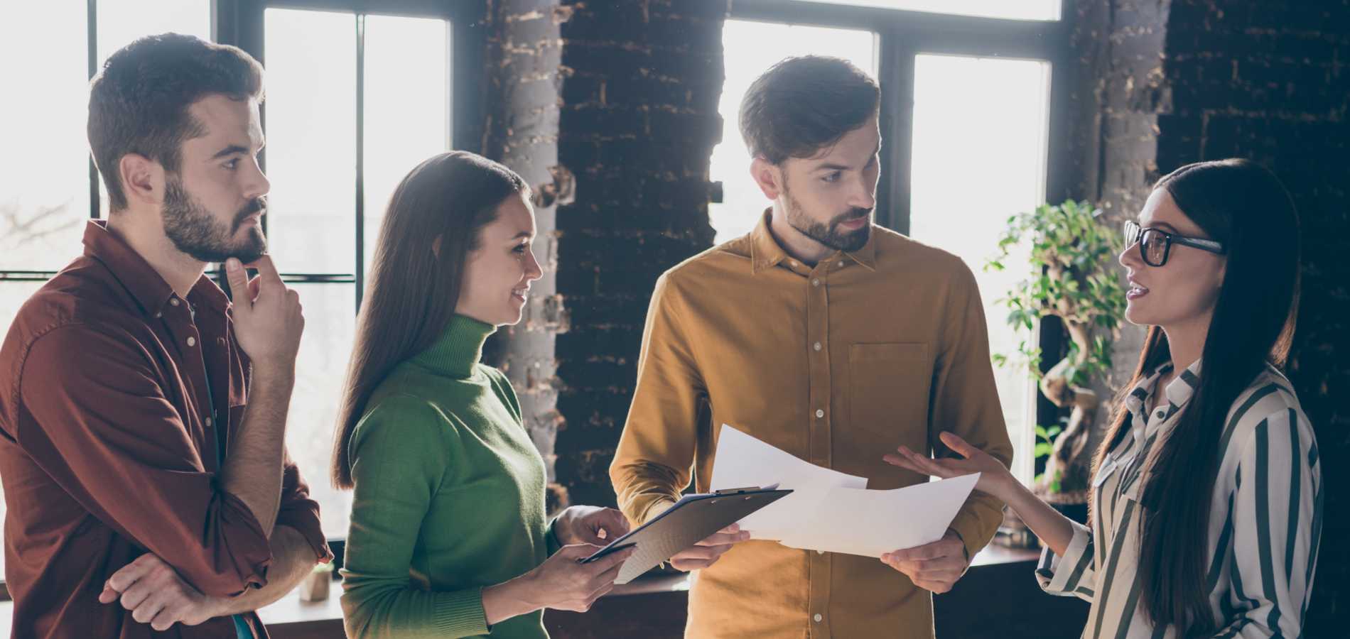 Four people in a meeting